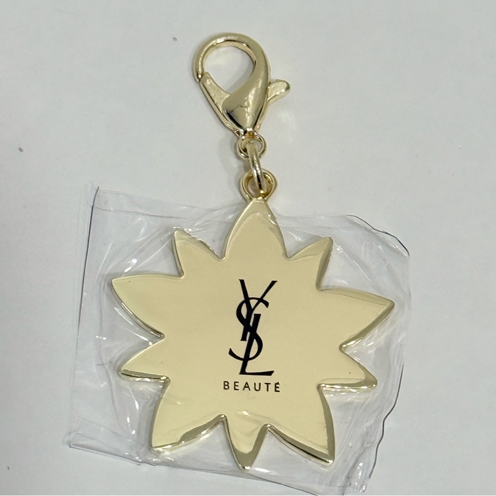 Yves Saint Laurent Beaute Gold Flower bag Charm keychain